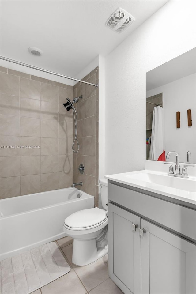 bathroom with toilet, vanity, visible vents, and bathing tub / shower combination