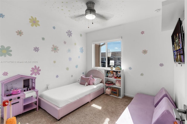 bedroom featuring a ceiling fan and light colored carpet