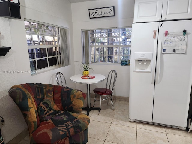 tiled dining area with a healthy amount of sunlight