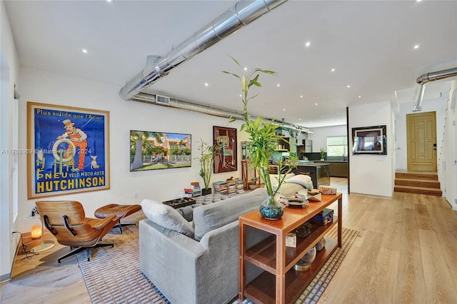 living room with light hardwood / wood-style flooring