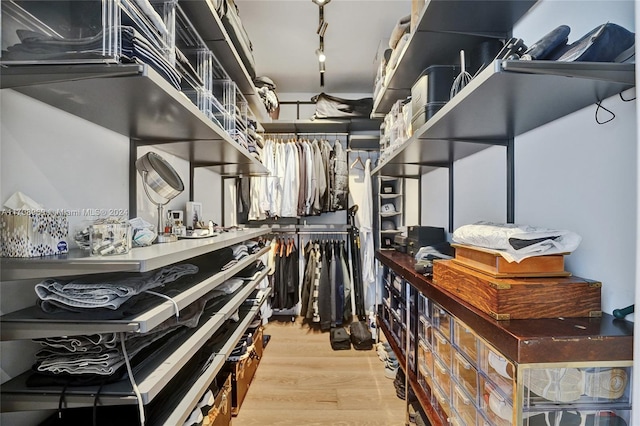 spacious closet featuring light hardwood / wood-style floors