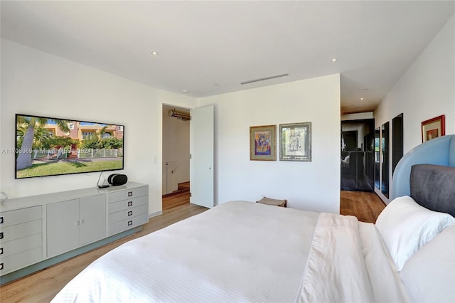 bedroom with light hardwood / wood-style floors