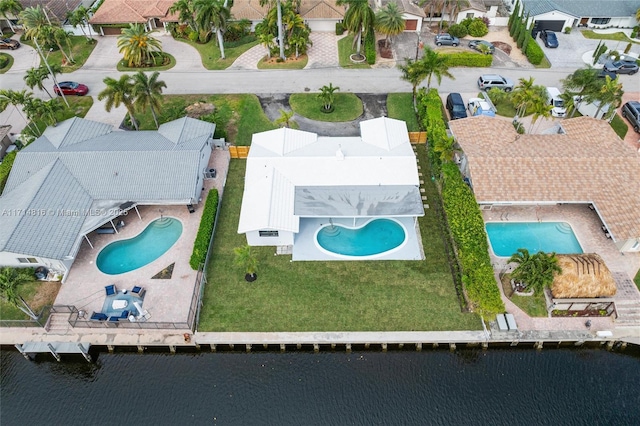 bird's eye view featuring a residential view and a water view