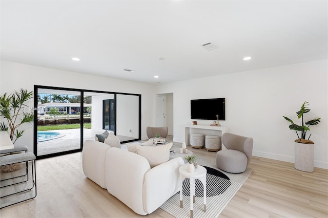 living room with light hardwood / wood-style floors