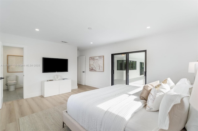 bedroom with access to exterior, light hardwood / wood-style flooring, and ensuite bath