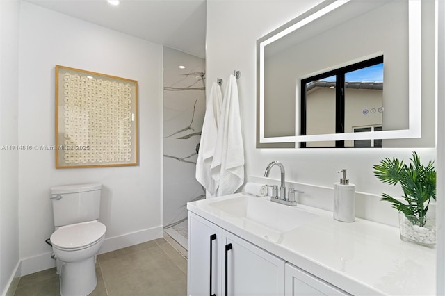 bathroom with vanity, toilet, and a shower