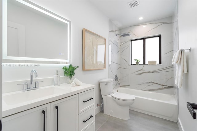 full bathroom featuring vanity, toilet, and tiled shower / bath combo