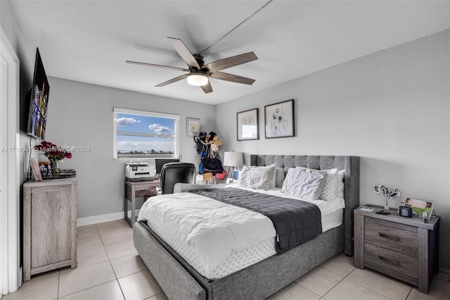 tiled bedroom featuring ceiling fan