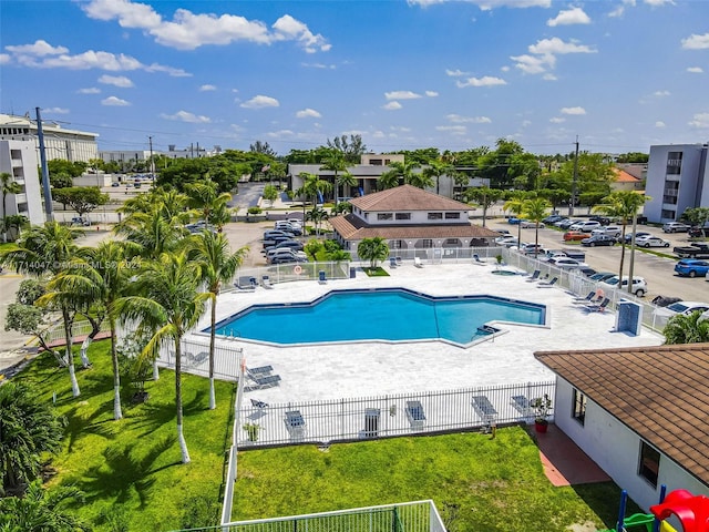 view of pool with a yard and a patio