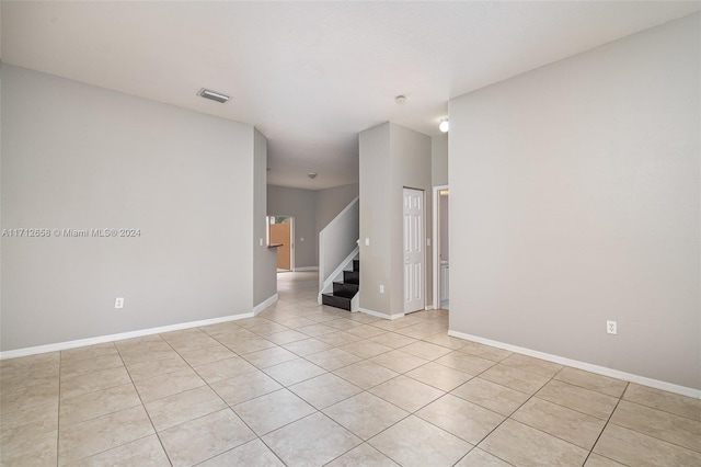 empty room with light tile patterned floors