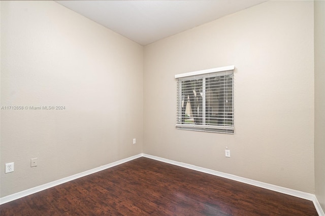 unfurnished room with hardwood / wood-style flooring