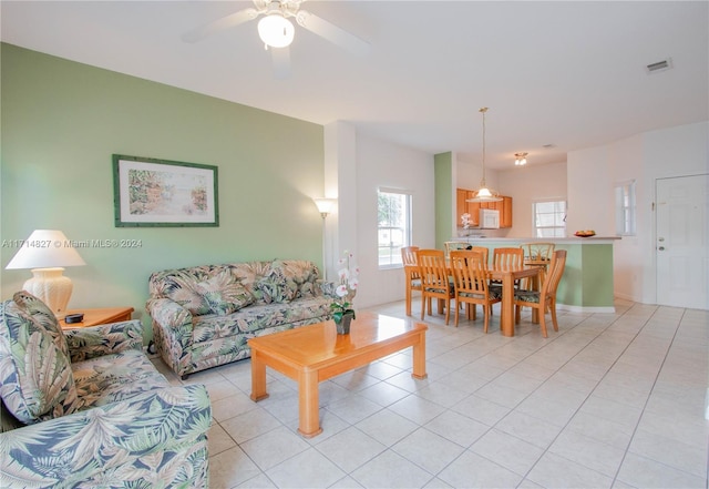 living room featuring ceiling fan and light tile patterned flooring