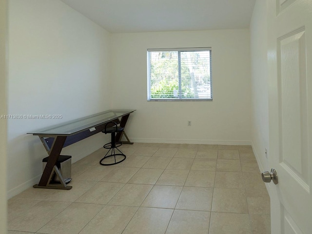 office area with light tile patterned floors