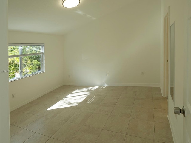 spare room with light tile patterned floors