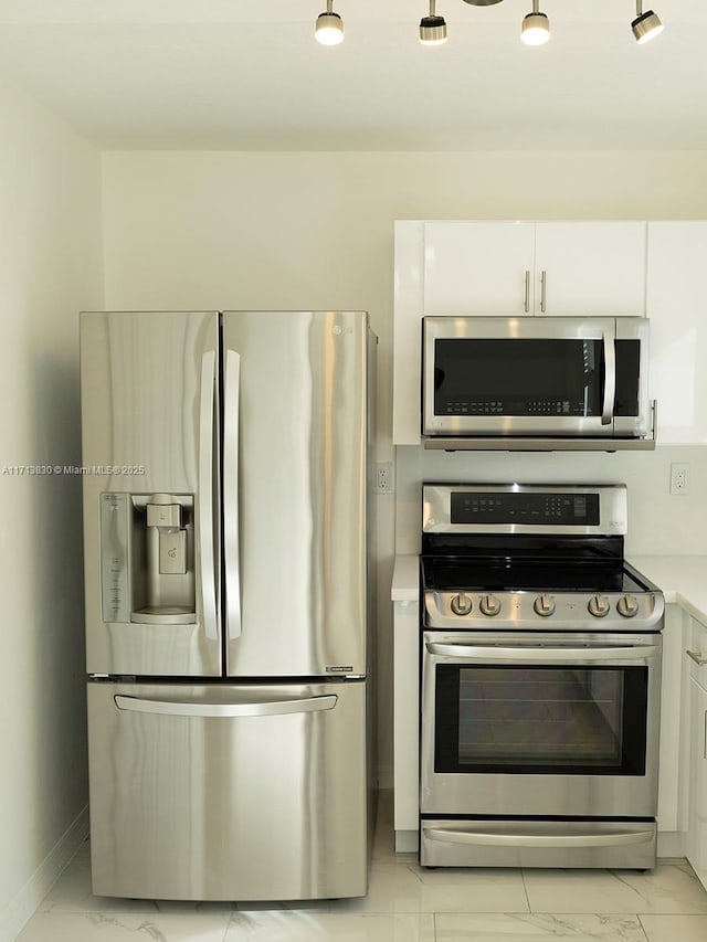 kitchen featuring white cabinets and stainless steel appliances