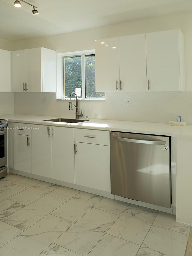 kitchen with sink, white cabinetry, and appliances with stainless steel finishes