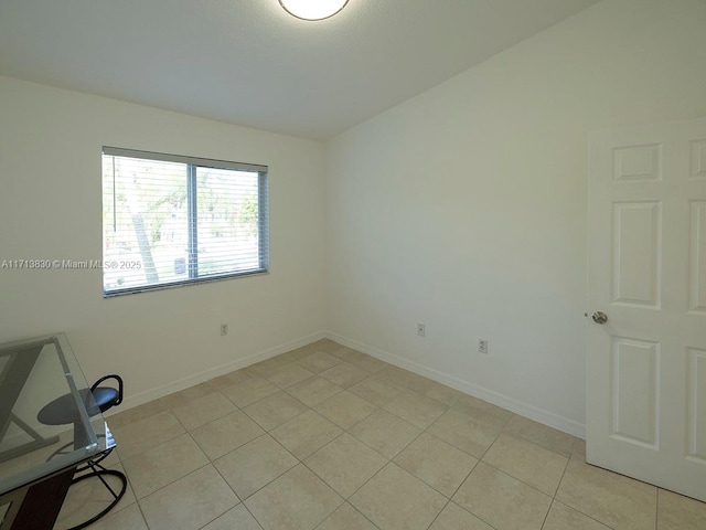 empty room with light tile patterned flooring