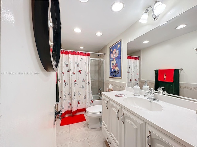 full bathroom featuring tile patterned flooring, vanity, shower / tub combo, and toilet