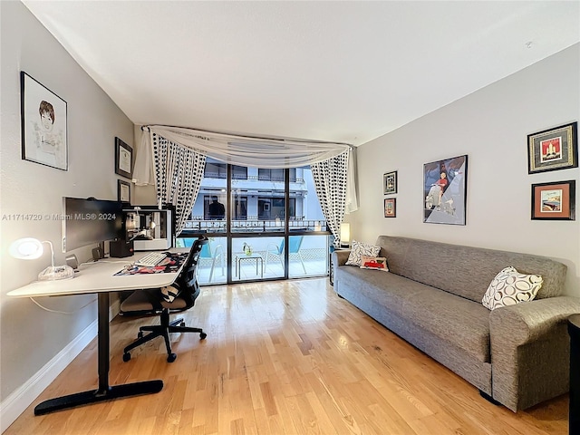 office area featuring hardwood / wood-style floors and expansive windows