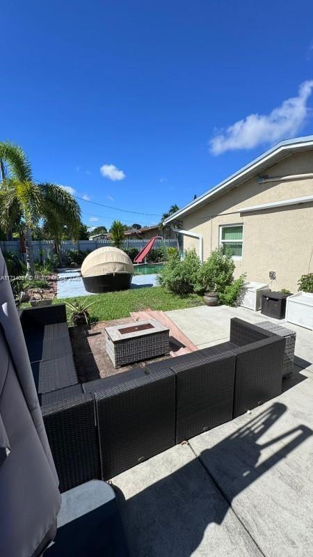 view of patio featuring outdoor lounge area and a playground