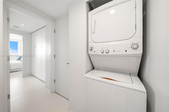 4779 Collins Ave Unit 3108, Miami Beach, FL 33140 - laundry area featuring stacked washing machine and dryer