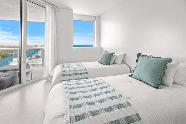 4779 Collins Ave Unit 3108, Miami Beach, FL 33140 - bedroom featuring a water view, access to outside, and floor to ceiling windows