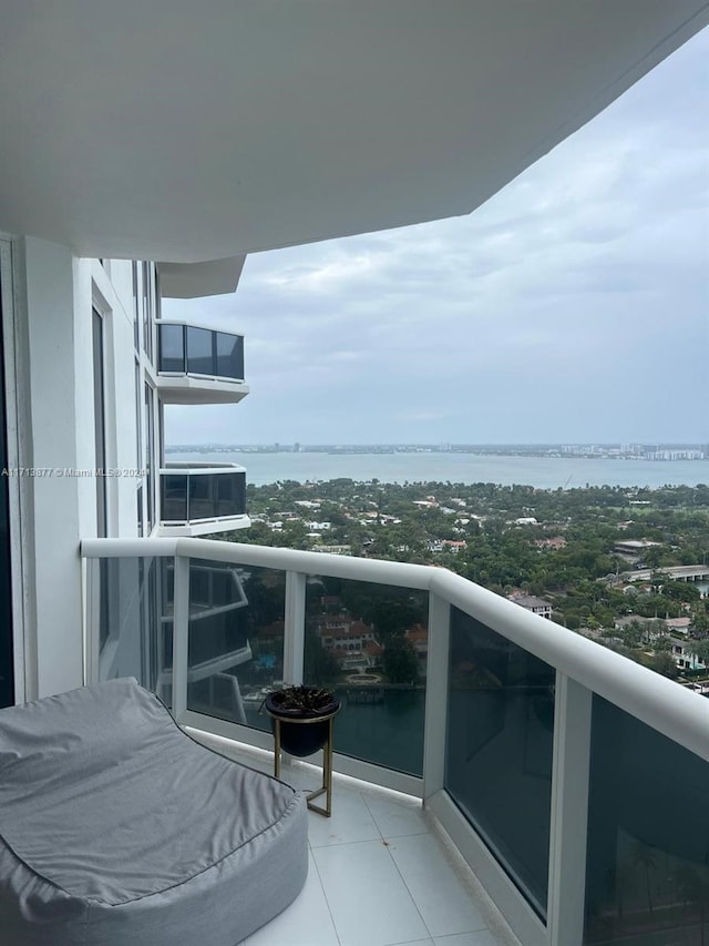 balcony featuring a water view