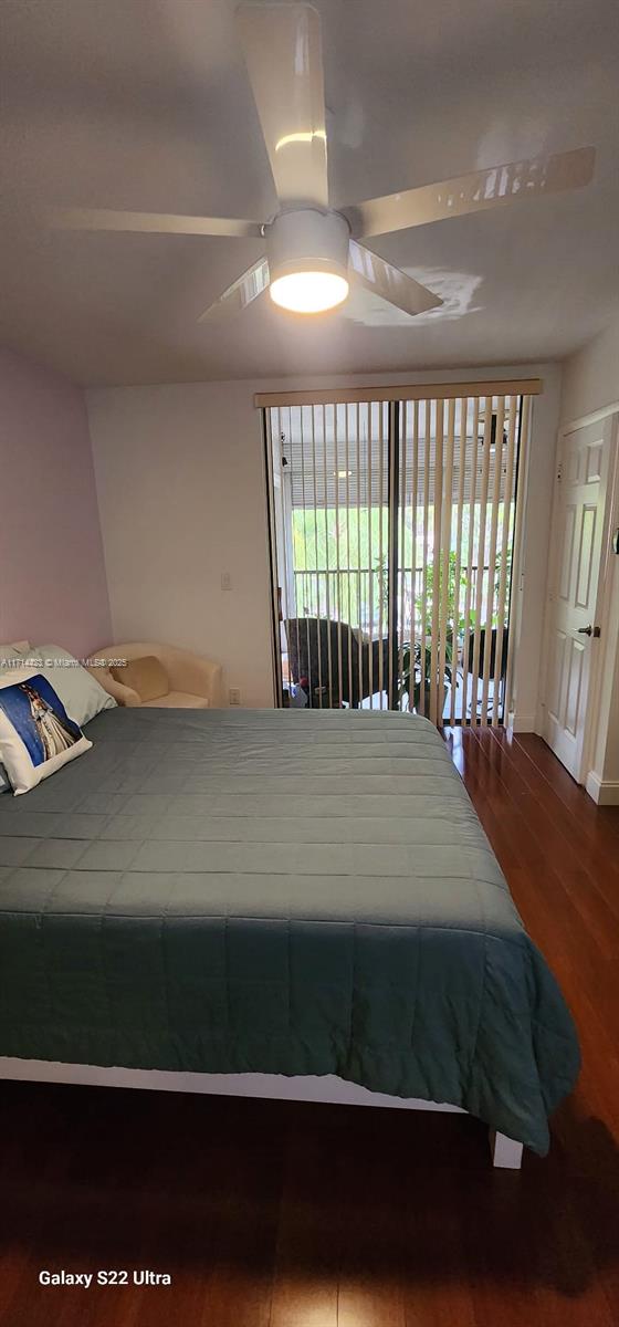 bedroom featuring hardwood / wood-style floors, access to outside, and ceiling fan