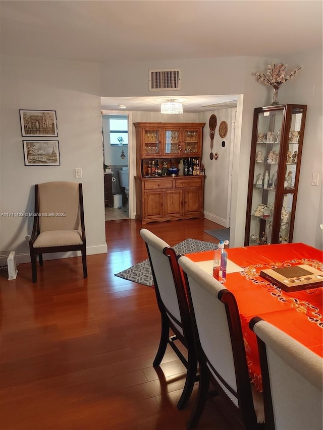 dining area with dark wood-type flooring