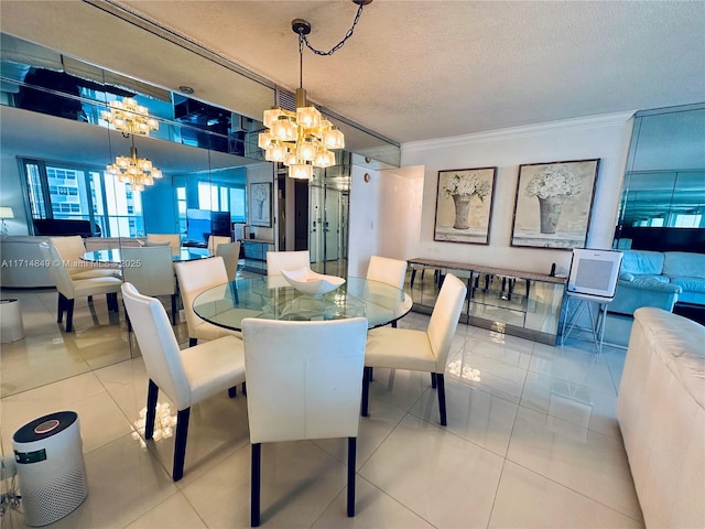 dining area with a textured ceiling, ornamental molding, light tile patterned floors, and a notable chandelier