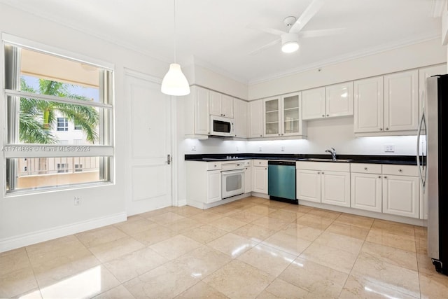 kitchen featuring sink, white cabinets, and appliances with stainless steel finishes