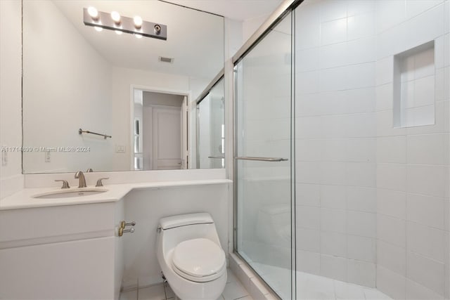 bathroom featuring walk in shower, tile patterned flooring, vanity, and toilet