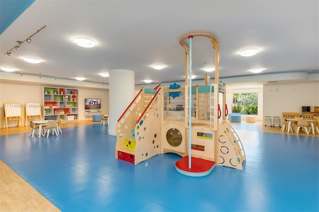 game room with concrete floors