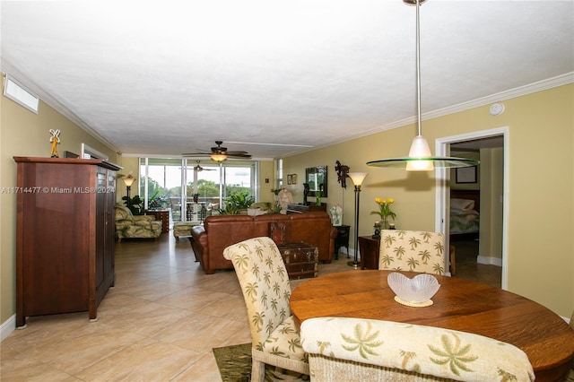 dining room with ceiling fan and crown molding