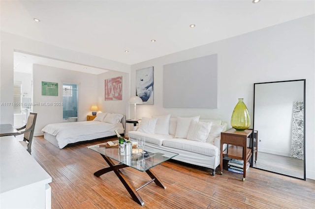 bedroom with hardwood / wood-style flooring