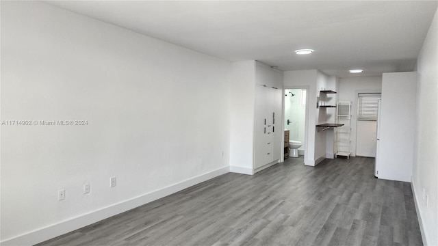 unfurnished room with hardwood / wood-style floors