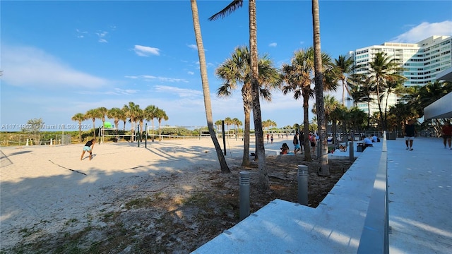 view of home's community featuring volleyball court