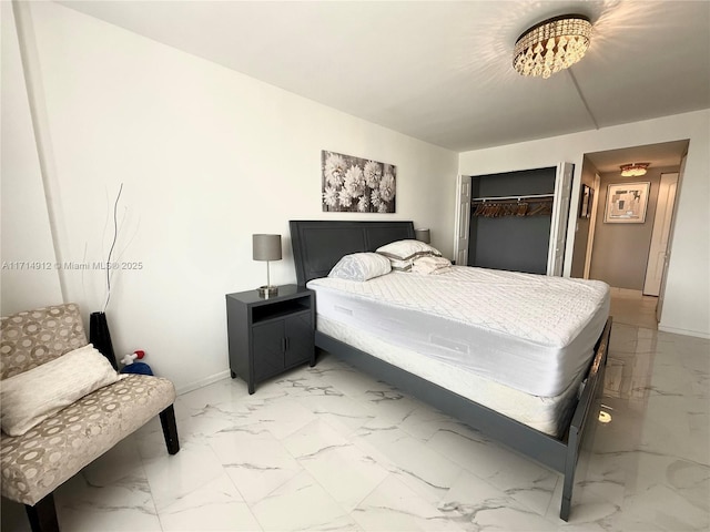 250 174th St Unit 2307, Sunny Isles Beach, FL 33160 - bedroom with light marble finish floors and a closet