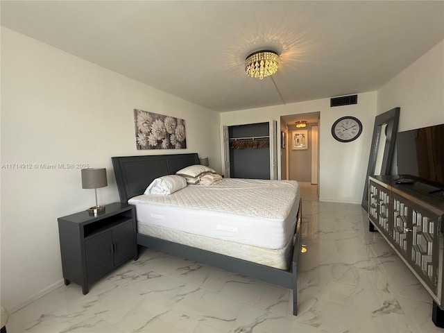 250 174th St Unit 2307, Sunny Isles Beach, FL 33160 - bedroom with light marble finish flooring and a closet