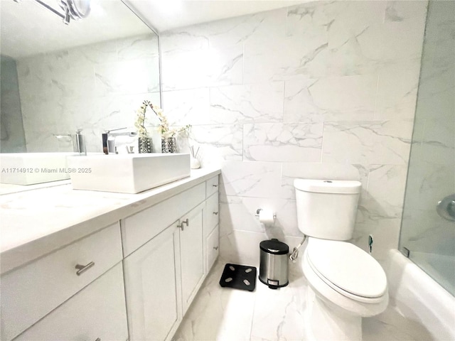 250 174th St Unit 2307, Sunny Isles Beach, FL 33160 - bathroom with vanity, marble finish floors, shower / washtub combination, and tile walls