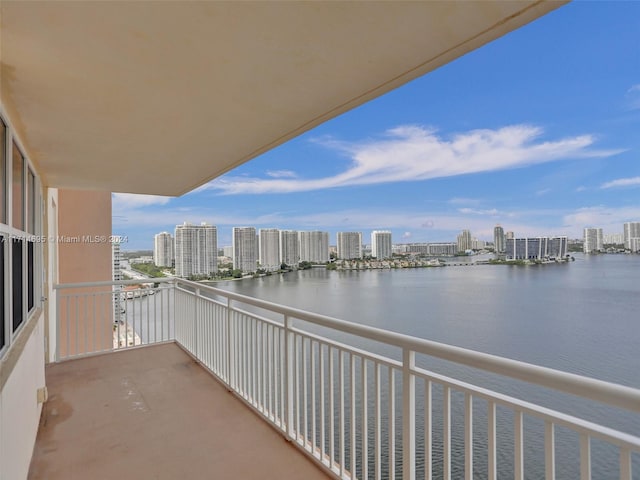 balcony featuring a water view