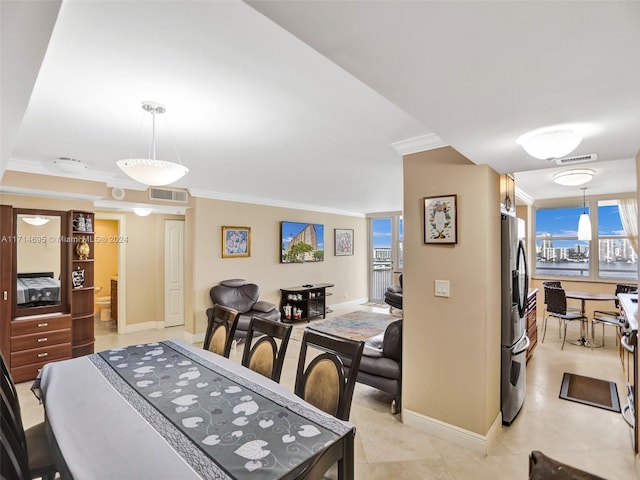 dining area featuring a wealth of natural light and ornamental molding