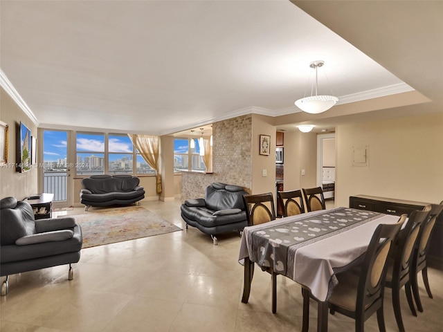 dining area featuring crown molding