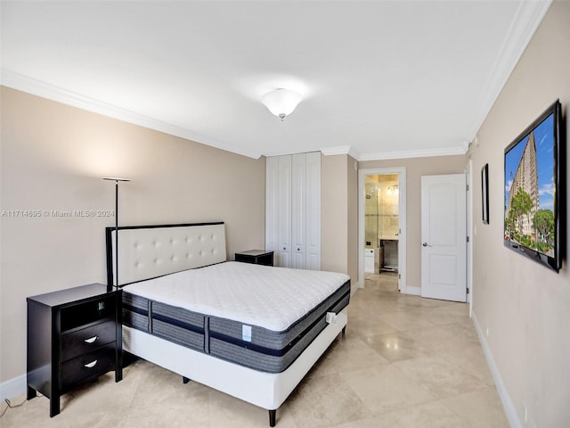 bedroom featuring connected bathroom and crown molding