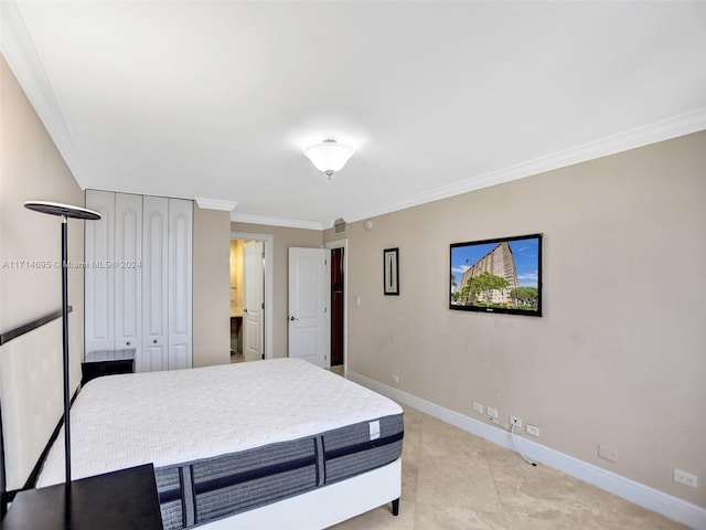 bedroom with light tile patterned floors and crown molding