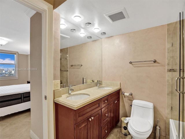 bathroom featuring tile patterned flooring, vanity, toilet, and walk in shower