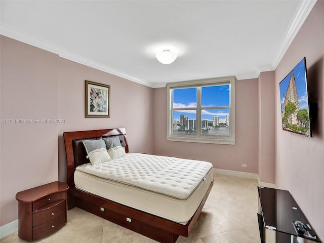 bedroom featuring light tile patterned flooring and ornamental molding