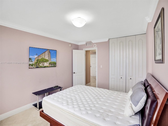 bedroom with crown molding and a closet