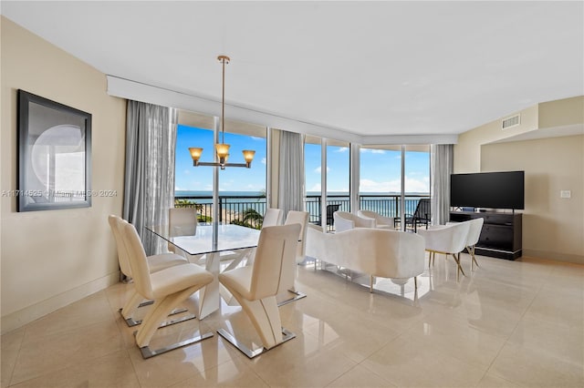 dining area with expansive windows, light tile patterned floors, a wealth of natural light, and a chandelier