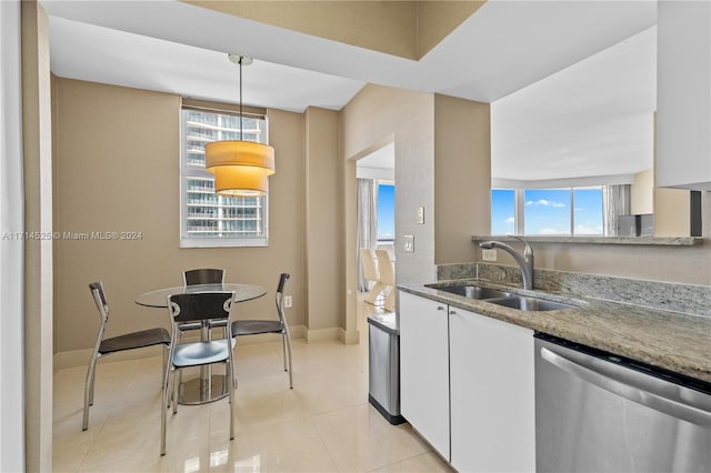 kitchen featuring white cabinetry, dishwasher, decorative light fixtures, and sink